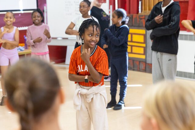 Young dancers taking part in a street dance workshop at a London summer camp