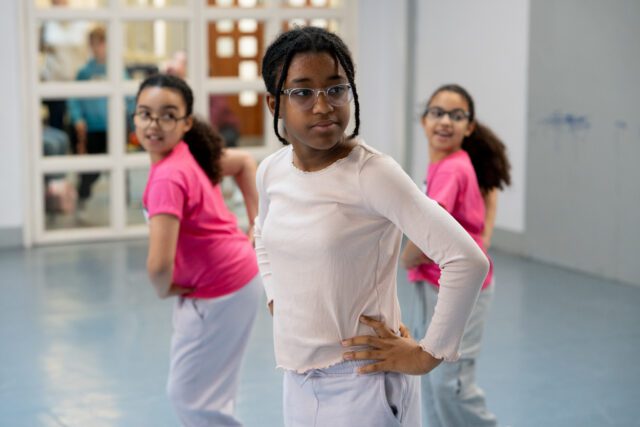 three girls having fun during dance class